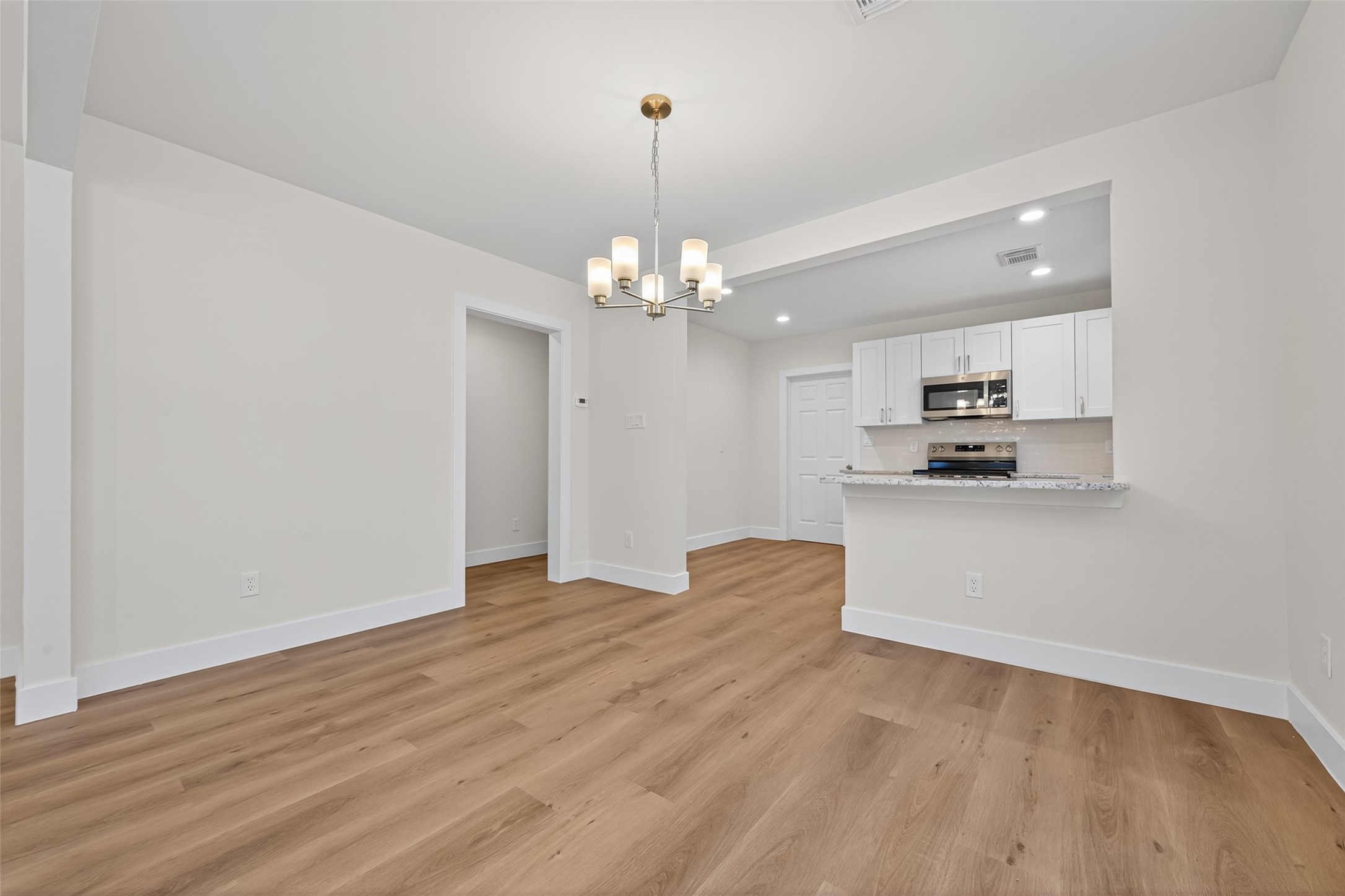 1418 Carlisle Street Rosenberg, TX 77471 - Photo 34 of 49 a view of a kitchen with microwave and cabinets