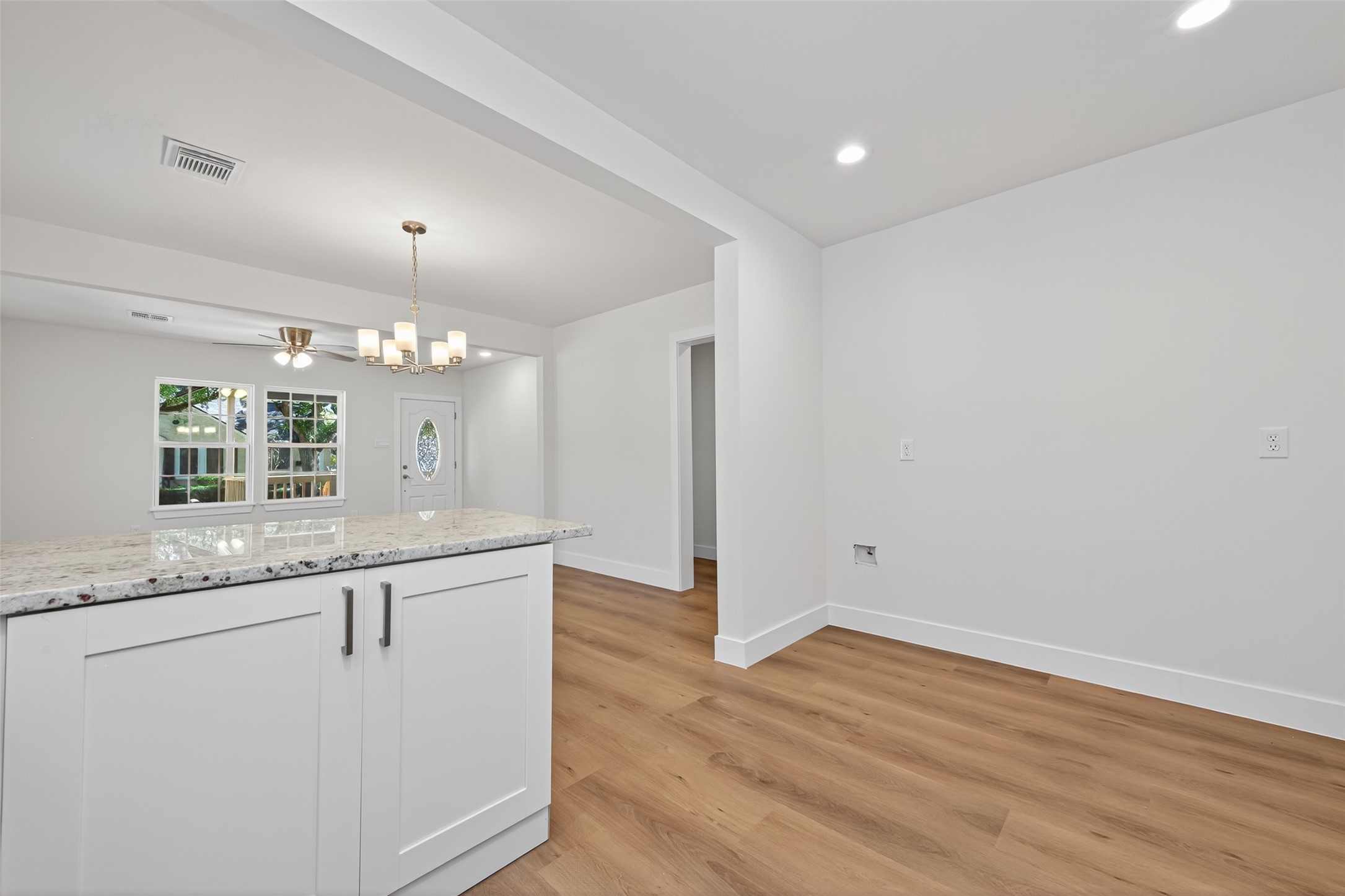 1418 Carlisle Street Rosenberg, TX 77471 - Photo 35 of 49 a view of a kitchen with granite countertop cabinets and wooden floor