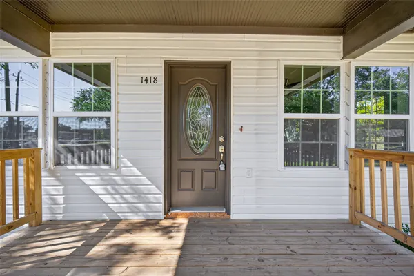 a front view of a house with a porch