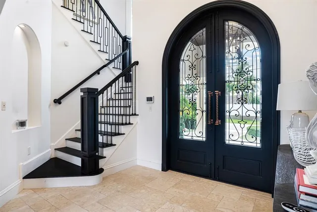 a view of a patio with couches and potted plants