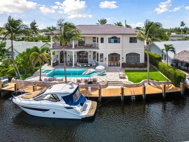 a very nice looking room with a dining table a chandelier