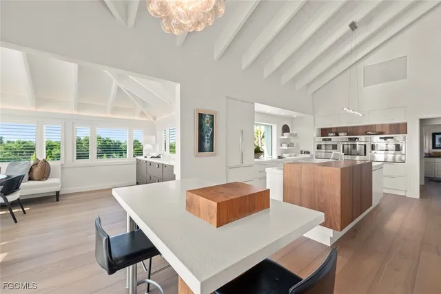 a living room with kitchen island furniture and a large window