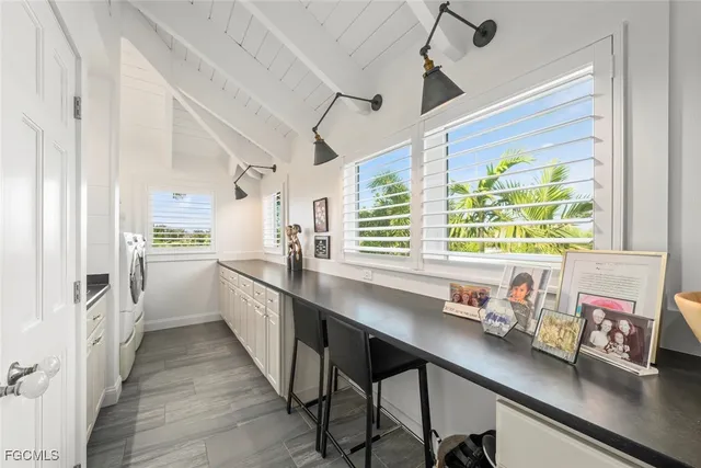 a kitchen with stainless steel appliances a sink and a window