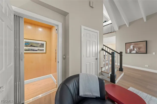 a view of a livingroom with furniture and a window