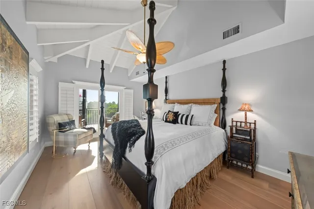 a bed room with bed and windows