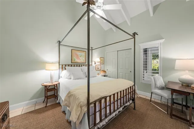 a bedroom with a bed and a table