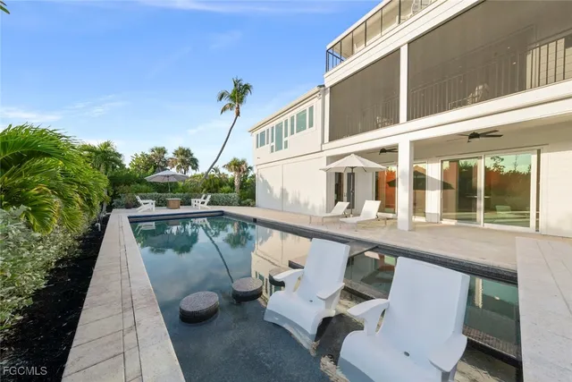 a view of a swimming pool with a patio
