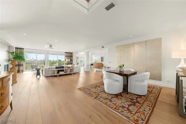 a view of a living room and dining room