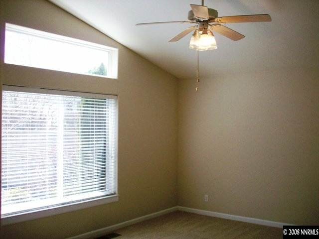 2460 Granite Springs Road Reno, NV 89519 - Photo 8 of 9 an empty room with a window and a fan