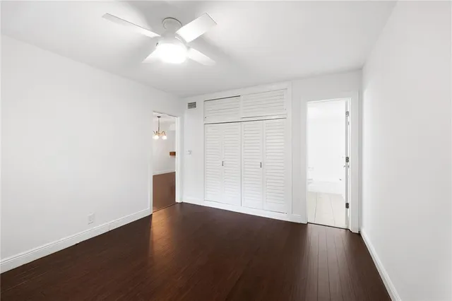 an empty room with wooden floor