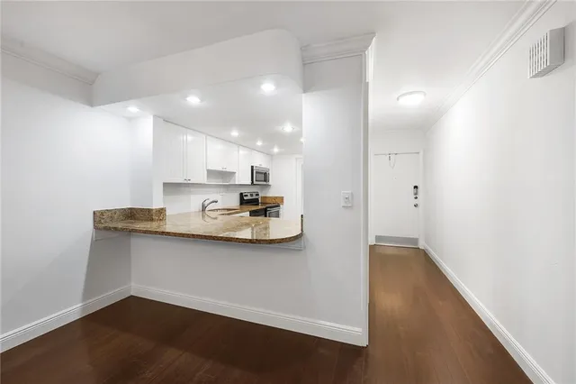 a view of kitchen with wooden floor