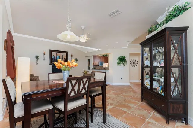 a dining room with furniture and window