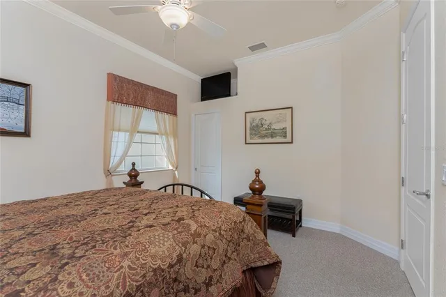 a bedroom with a bed and a chair