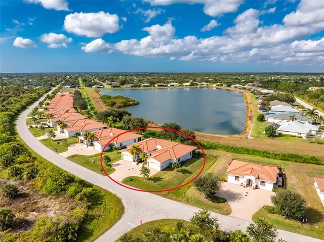 a backyard of a house with a garden and plants