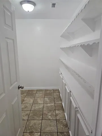 a view of an empty walk in closet