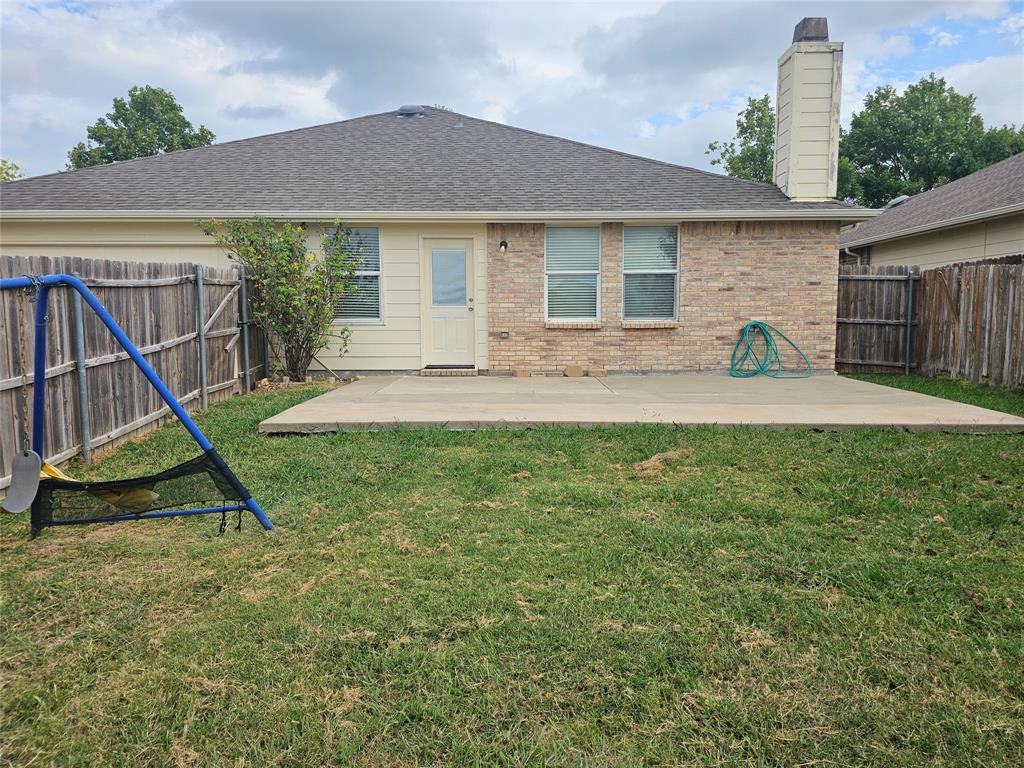 3009 Meadow Bluff Drive Wylie, TX 75098 - Photo 23 of 24 a view of a house with a backyard and a tree