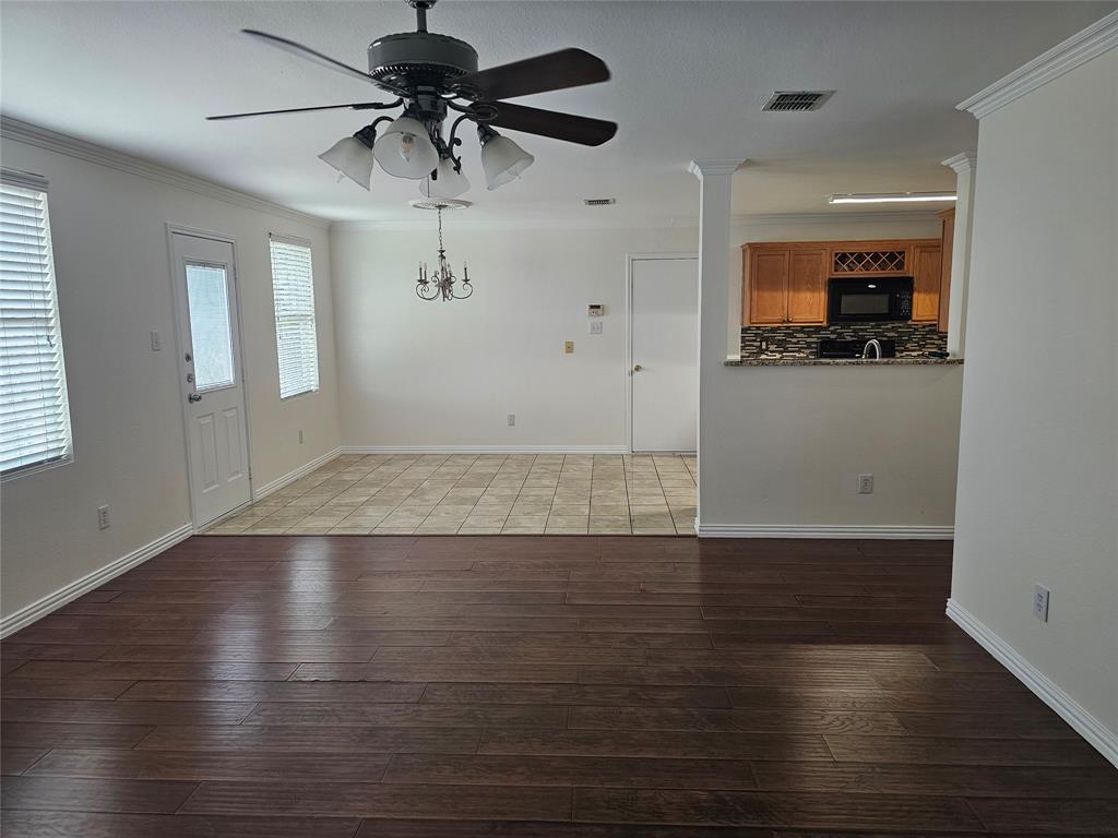 3009 Meadow Bluff Drive Wylie, TX 75098 - Photo 10 of 24 wooden floor in an empty room with a window