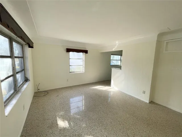 an empty room with windows