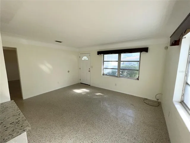 an empty room with windows