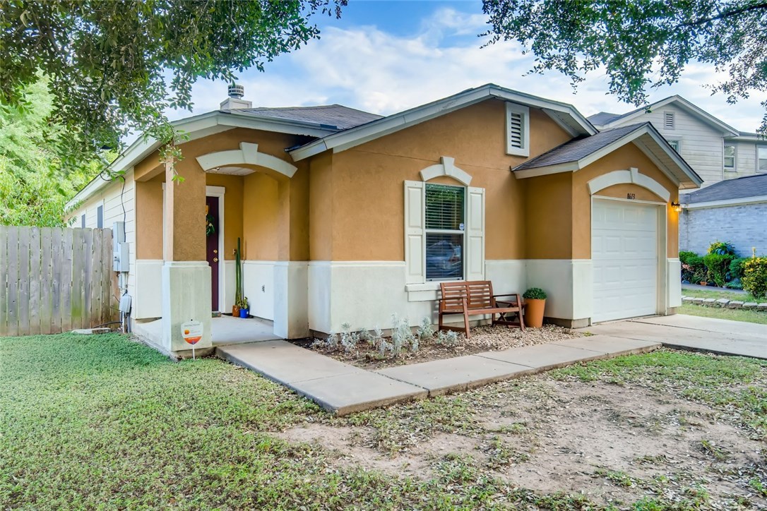 8613 Claude Court Austin, TX 78747 - Photo 1 of 1 a front view of a house with garden