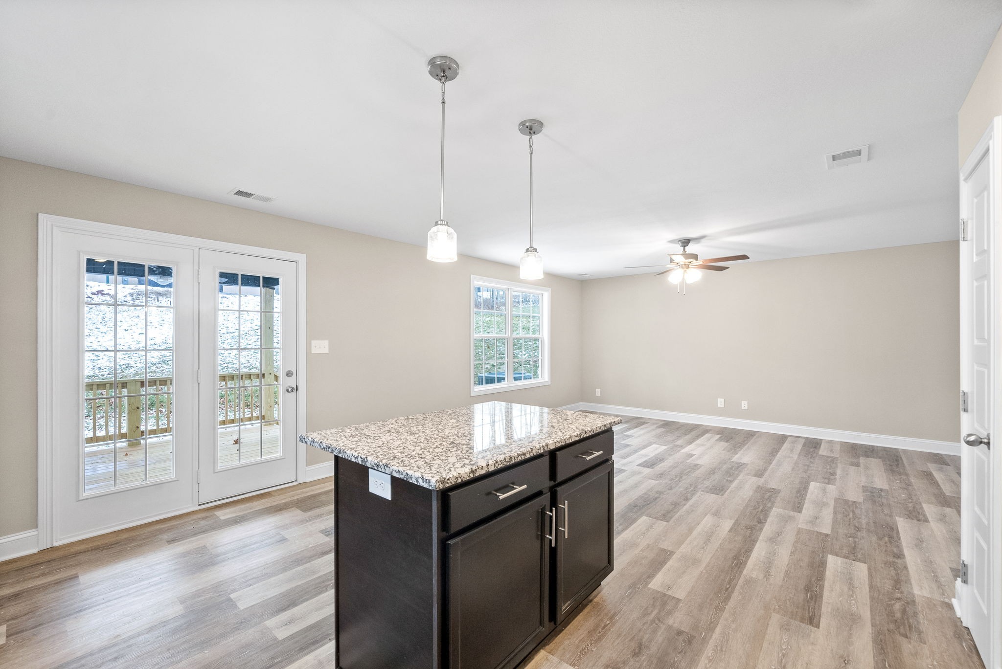 1237 Cardinal Crk Drive Clarksville, TN 37040 - Photo 7 of 26 a kitchen with granite countertop wooden cabinets and a wooden floor