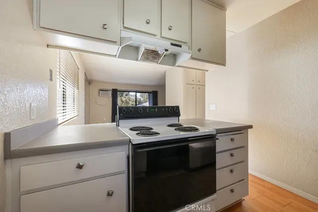 a kitchen with a stove and a microwave