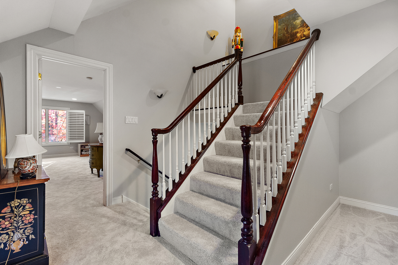 721 Chatfield Road New Lenox, IL 60451 - Photo 39 of 76 a view of staircase with lots of frames on wall and wooden floors