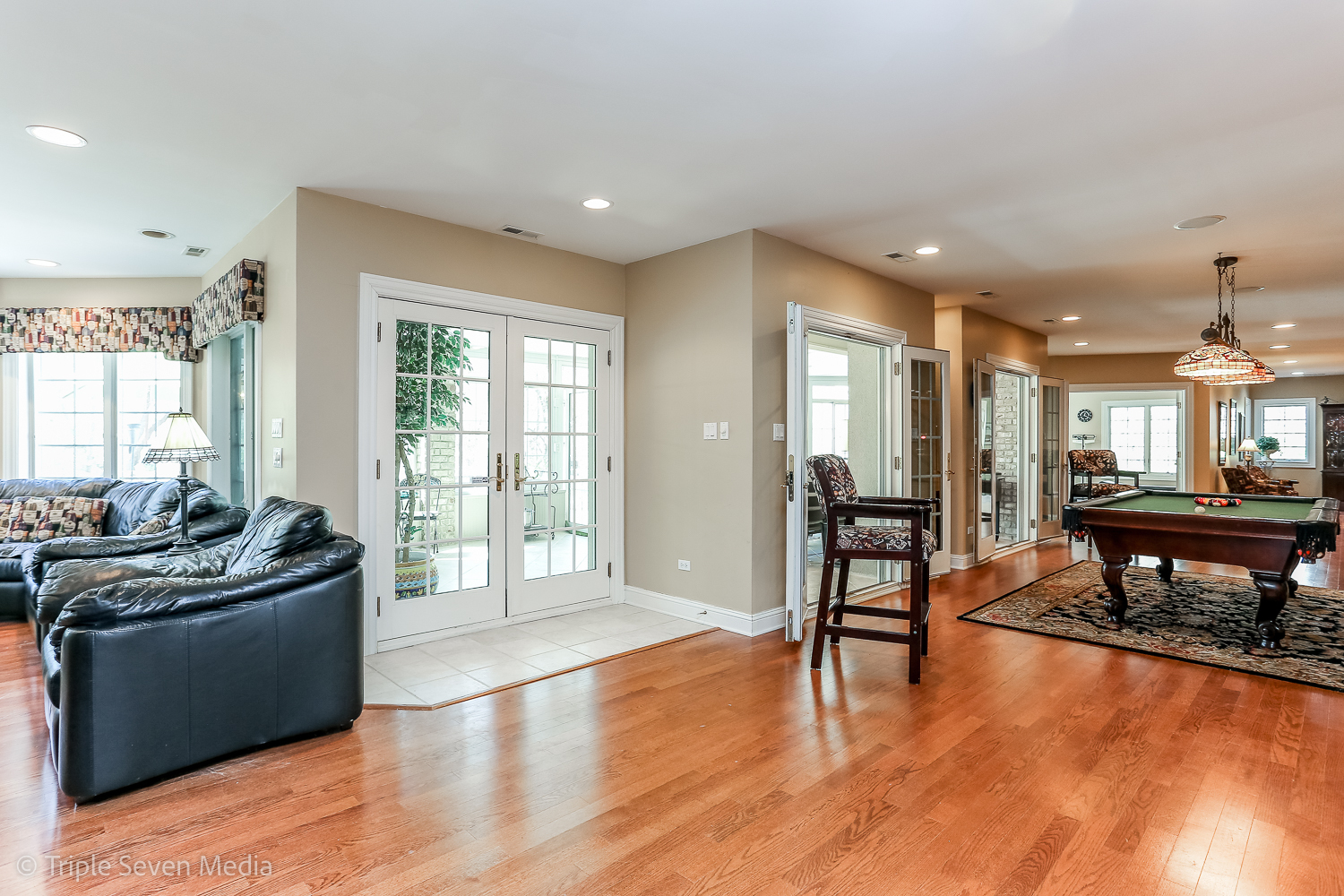 721 Chatfield Road New Lenox, IL 60451 - Photo 56 of 76 a living room with furniture a dining table and chairs with wooden floor