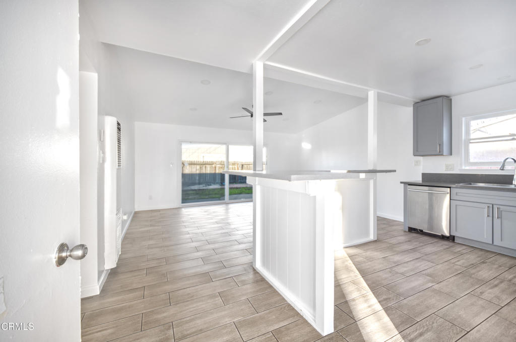 1931 Ukiah Street Oxnard, CA 93035 - Photo 2 of 12 a view of a kitchen with wooden floor and electronic appliances