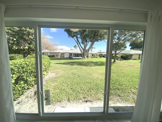 a view of a room that has a large window