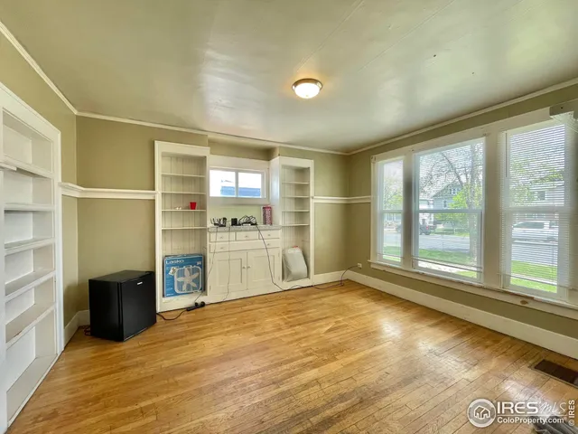a view of a kitchen with a sink and a large window