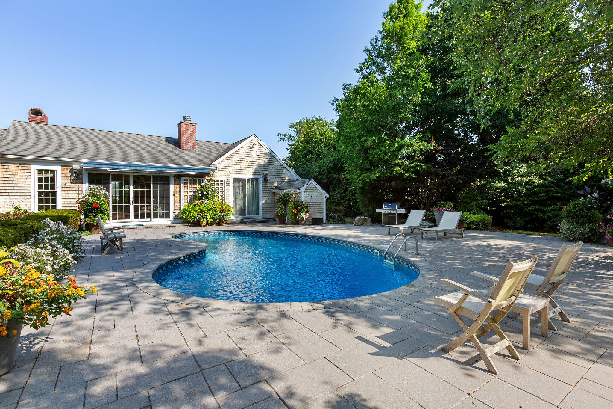 36 Cedar Land Road Orleans, MA 02653 - Photo 32 of 100 a view of a house with swimming pool and sitting area
