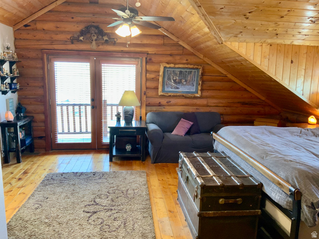 76 Highway 118 Monroe, UT 84754 - Photo 37 of 76 Bedroom with wood ceiling, light wood-type flooring, rustic walls, vaulted ceiling, and access to outside