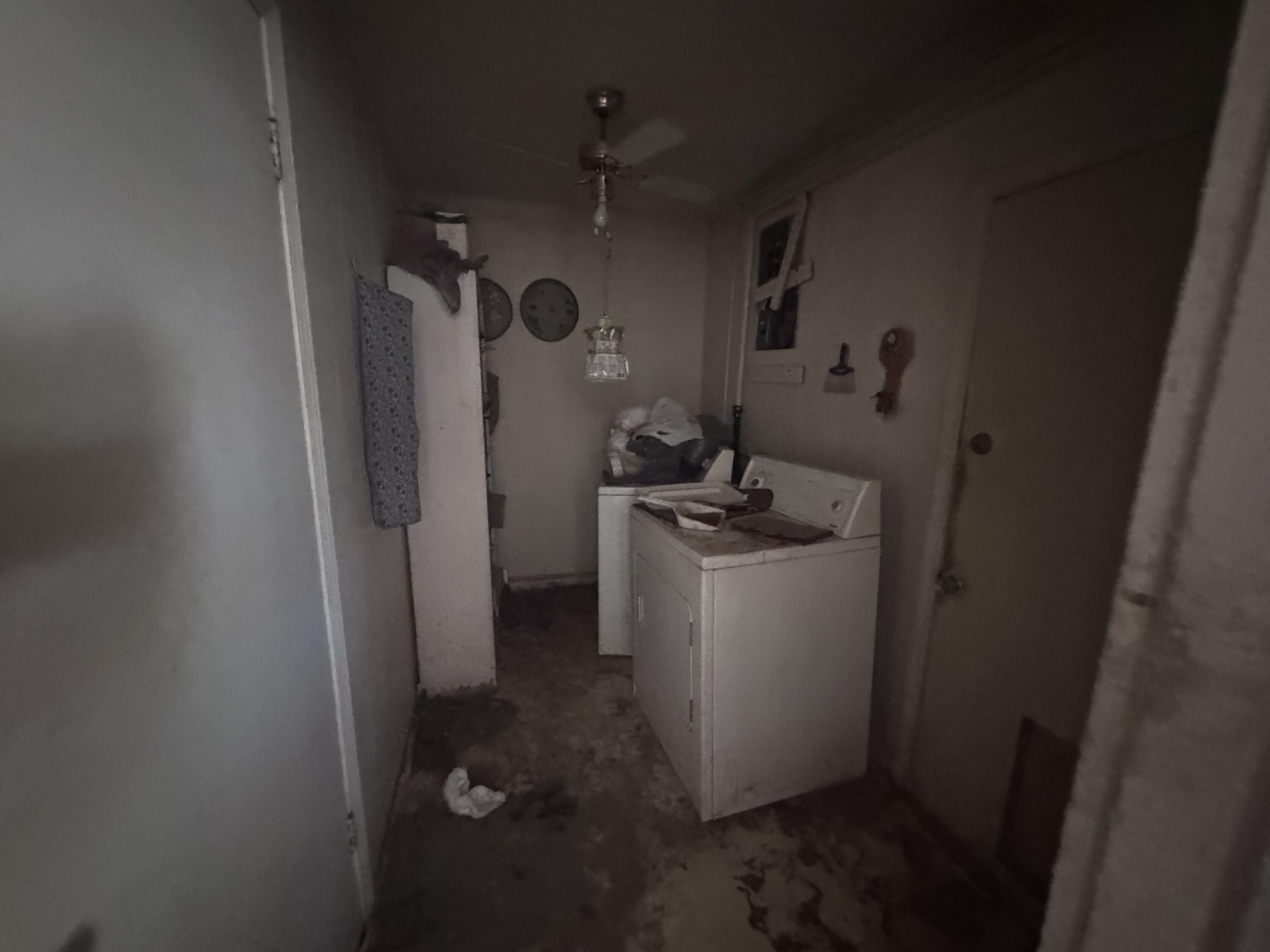 5116 44th Street Lubbock, TX 79414 - Photo 11 of 14 a room with water heater and a refrigerator
