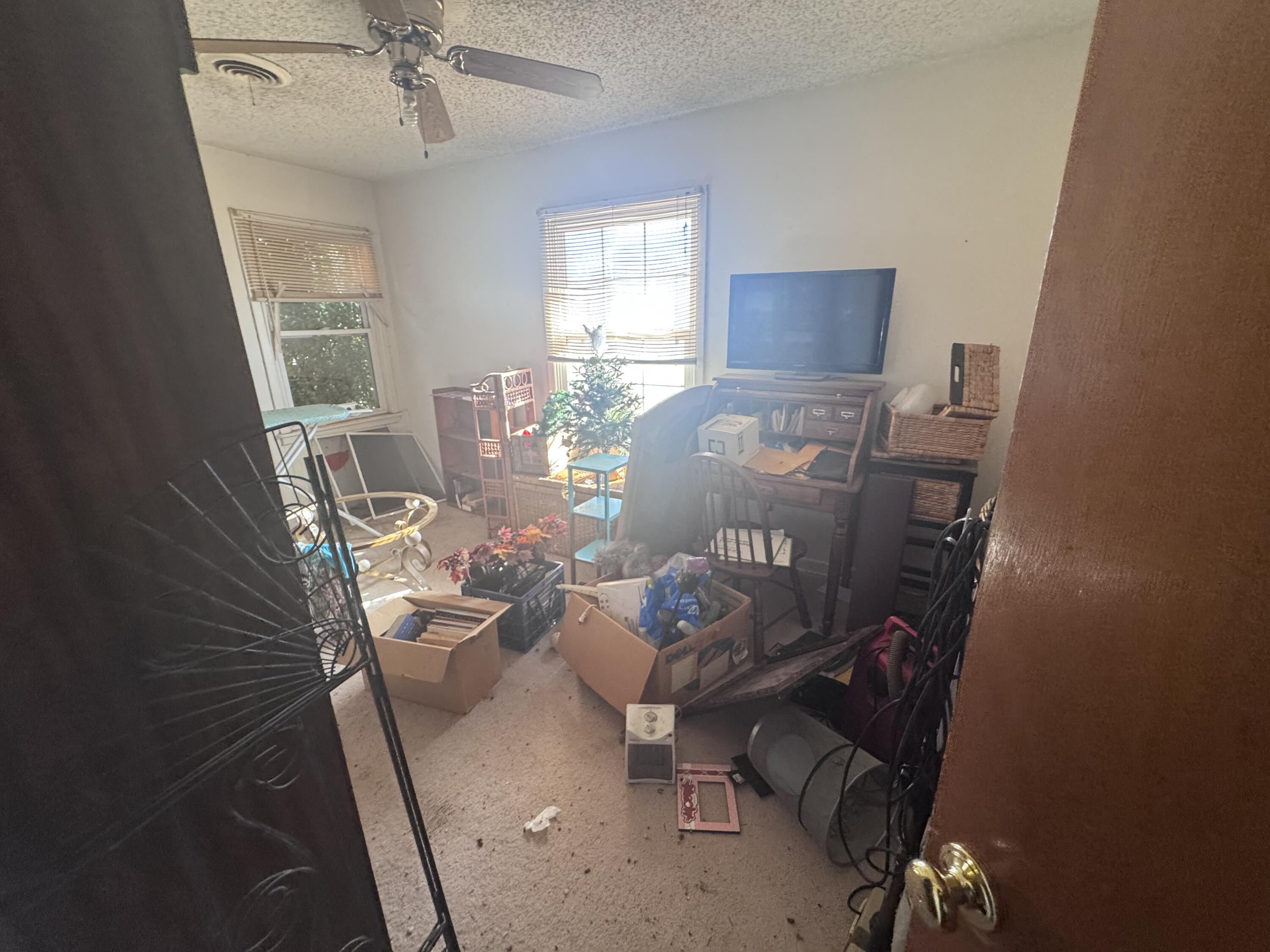 5116 44th Street Lubbock, TX 79414 - Photo 12 of 14 a view of a workspace with furniture and a window