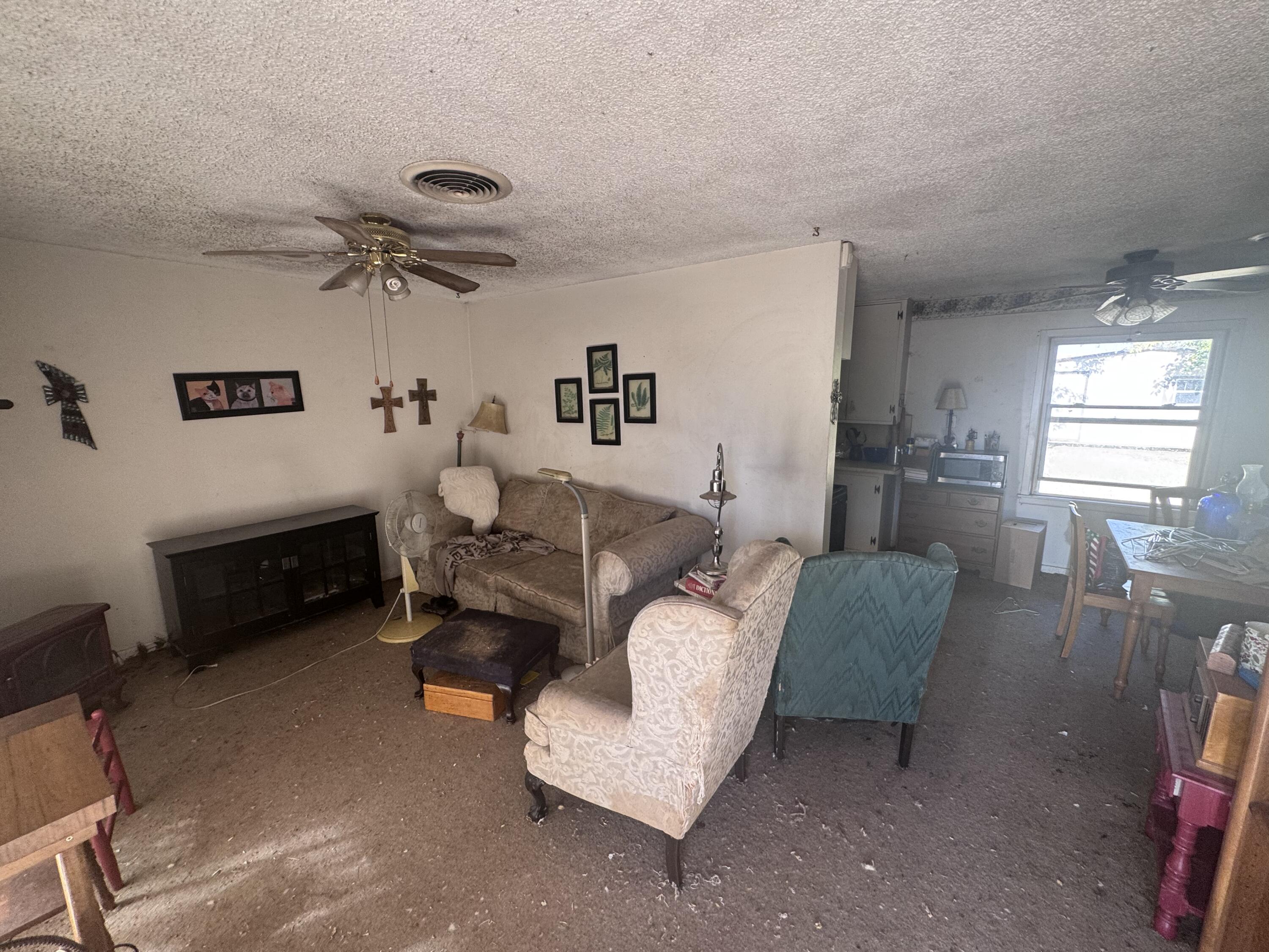 5116 44th Street Lubbock, TX 79414 - Photo 6 of 14 a living room with furniture and a window