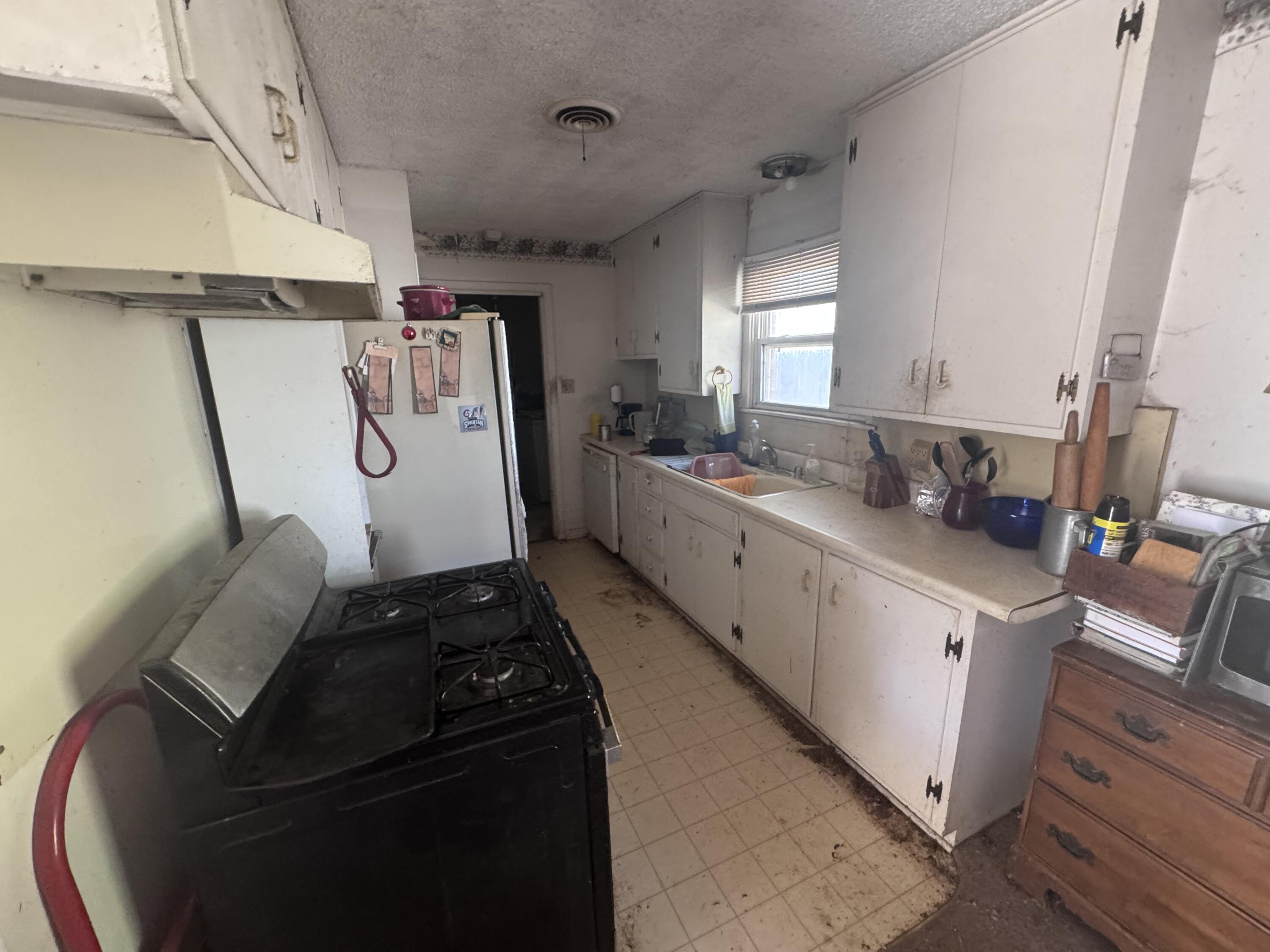 5116 44th Street Lubbock, TX 79414 - Photo 7 of 14 a room with storage and utility
