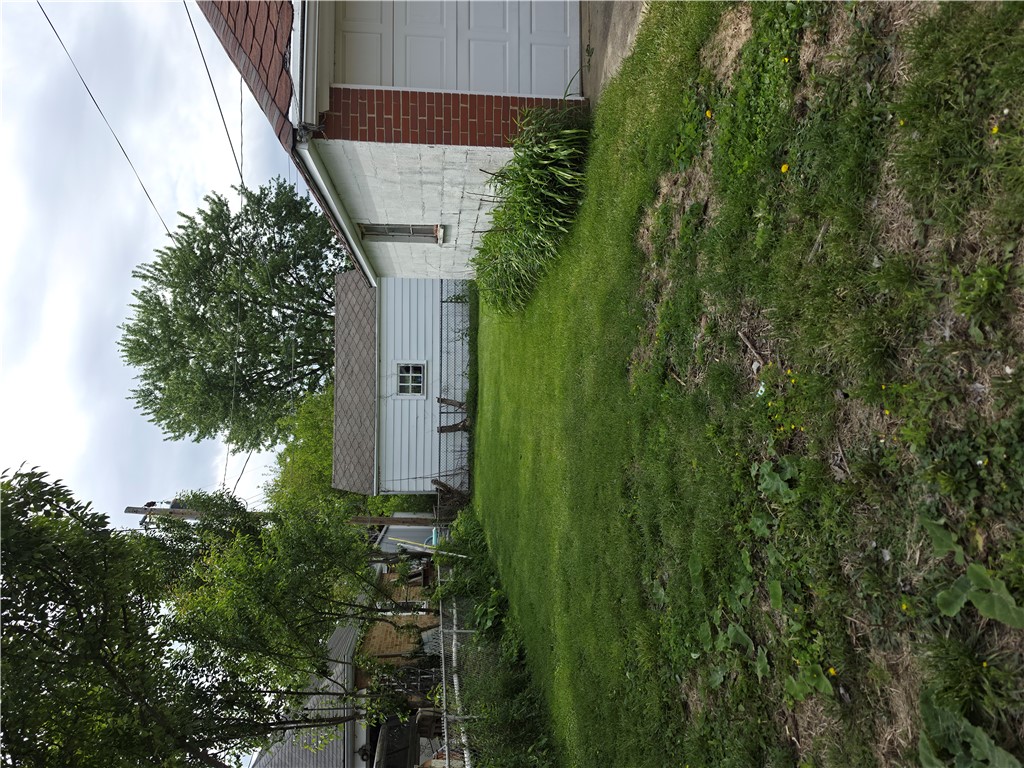 3109 Shroyer Road Kettering, OH 45429 - Photo 21 of 25 This spacious yard offers ample outdoor living potential, featuring lush green landscaping.