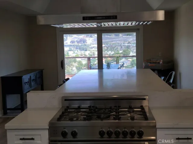 a kitchen with a stove and a cabinet