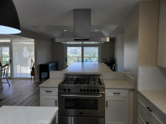 a kitchen with a stove and a sink