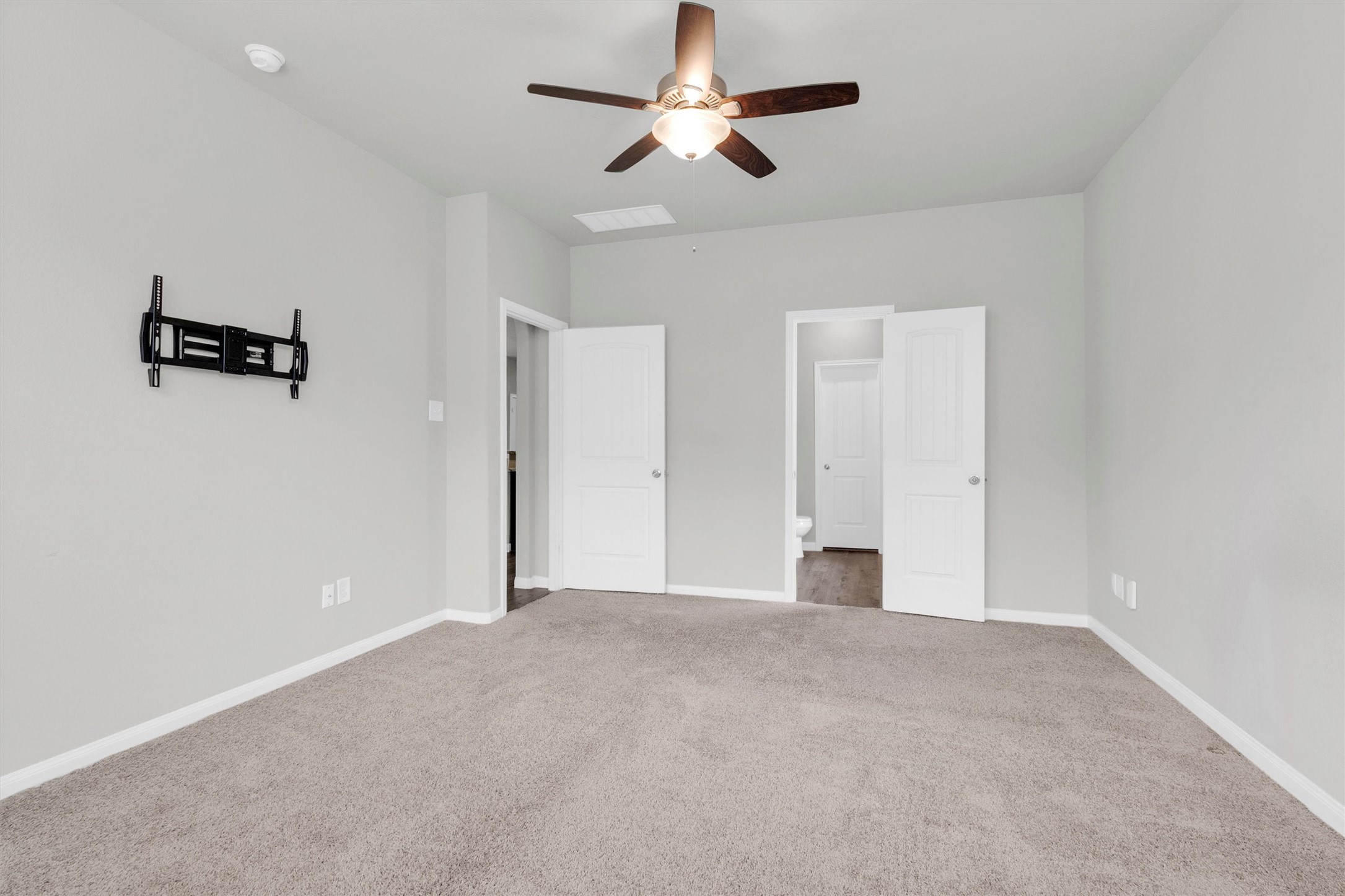 13534 Luke Prairie Willis, TX 77378 - Photo 16 of 29 Primary bedroom looking back to the bathroom.