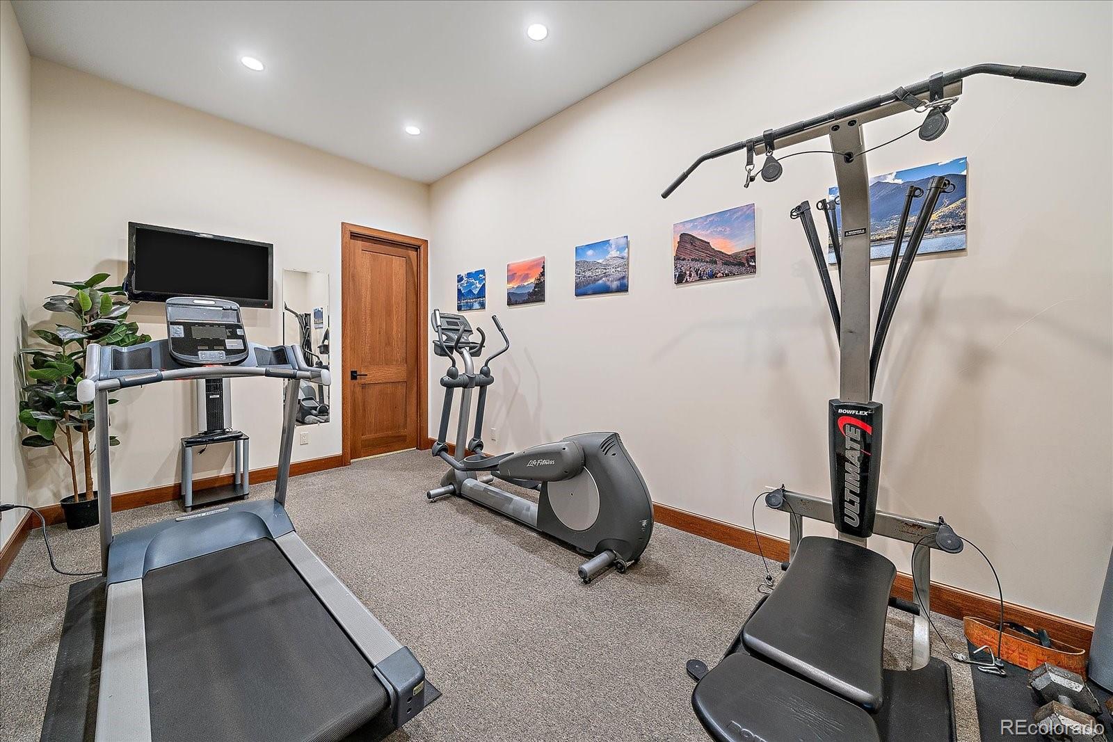 4331 Hilltop Road Evergreen, CO 80439 - Photo 37 of 45 a view of a room with gym equipment
