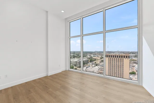 a view of a swimming pool with a lounge chair