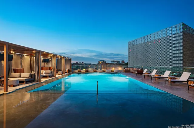 an aerial view of a residential apartment building with a yard