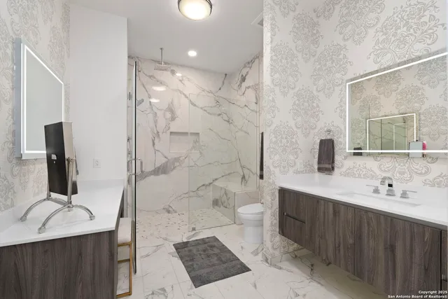 a view of a hallway with wooden floor and entryway