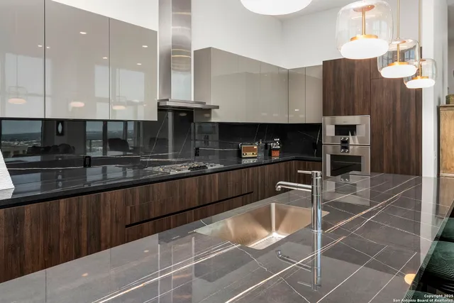 a stove top oven sitting inside of a kitchen