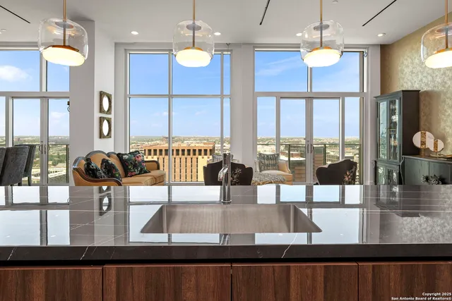 a bathroom with a sink mirror and a shower