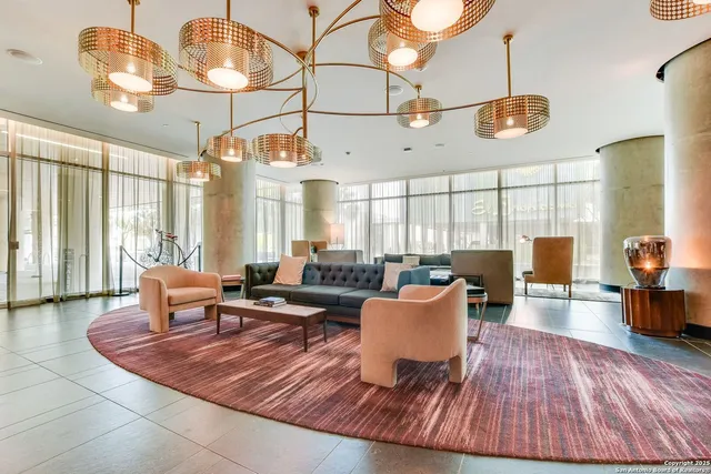 a living room with a large window and couch