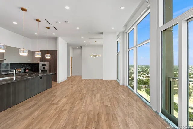 a large kitchen with stainless steel appliances lots of counter space