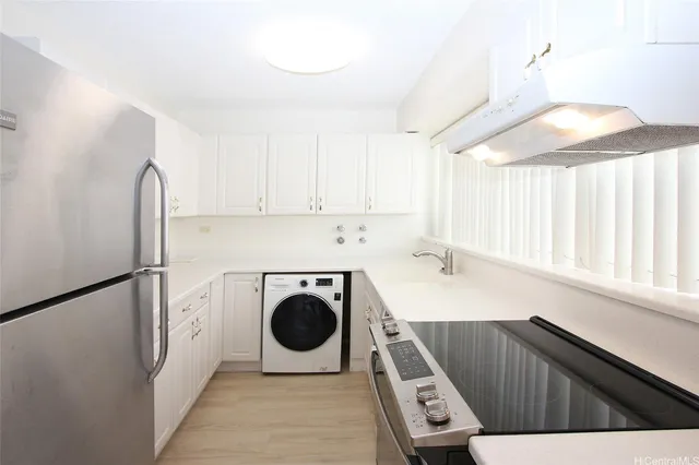 a view of kitchen and washer and dryer